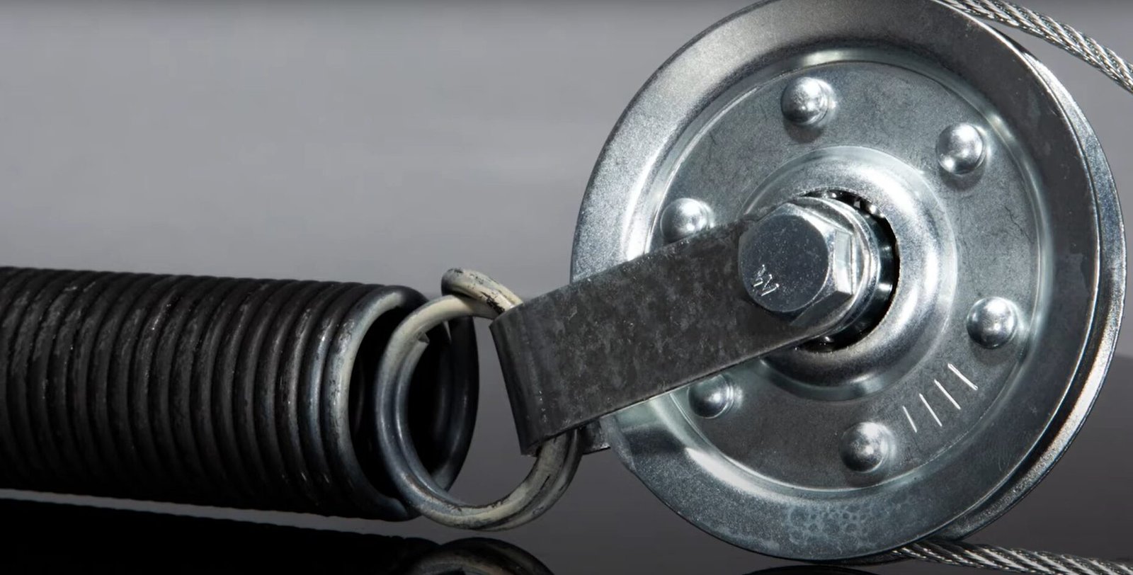 Professional technician performing garage spring door repair at Local Garage Door Repair Company