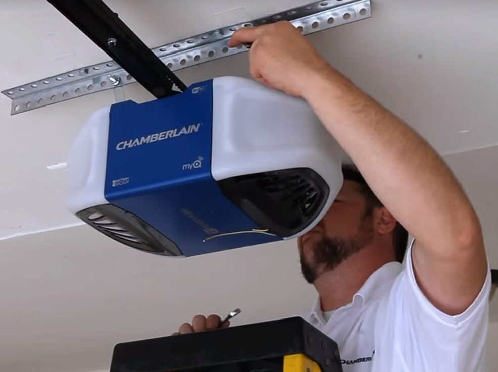 Technician performing garage opener door repair for a Local Garage Door Repair Company service call